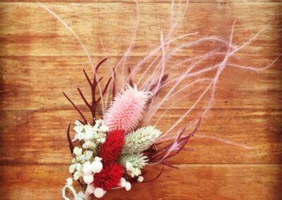 Pink boutonniere with stipa pennata.