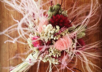 Pink bridal bouquet with stipa pennata.