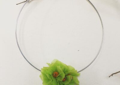 Green necklace made with hydrangea and yellow jazilda