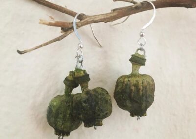 Green poppy head earrings.